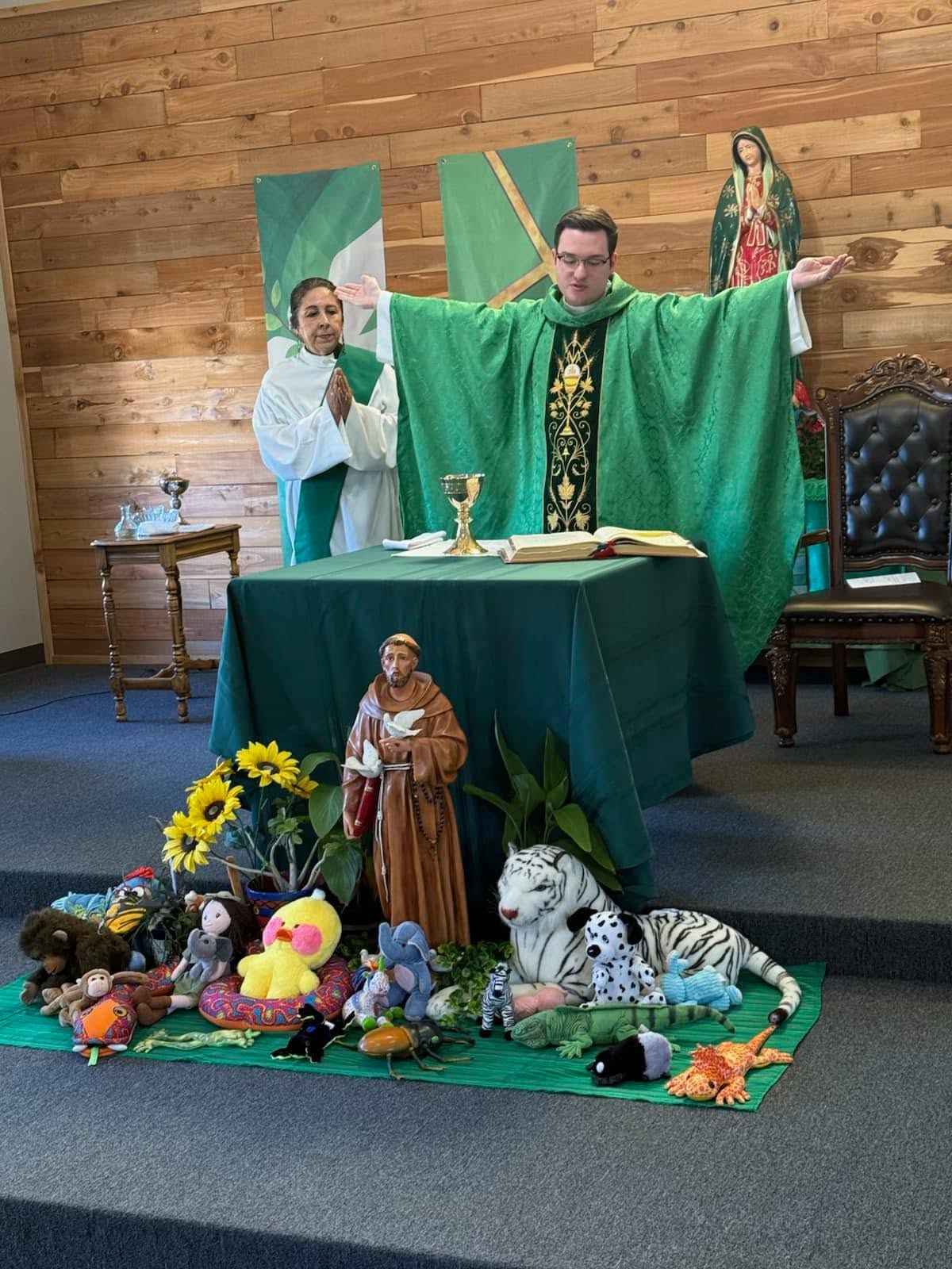 Father Brett and Deacon Elsa lead a Blessing of the Animals at the altar of Holy Spirit Catholic Church.
